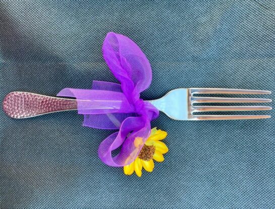 Fork wrapped in a purple bow